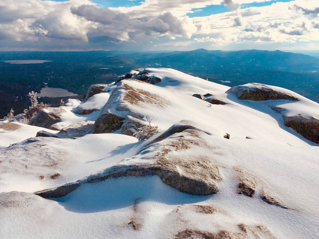 view from a snow covered mountain top