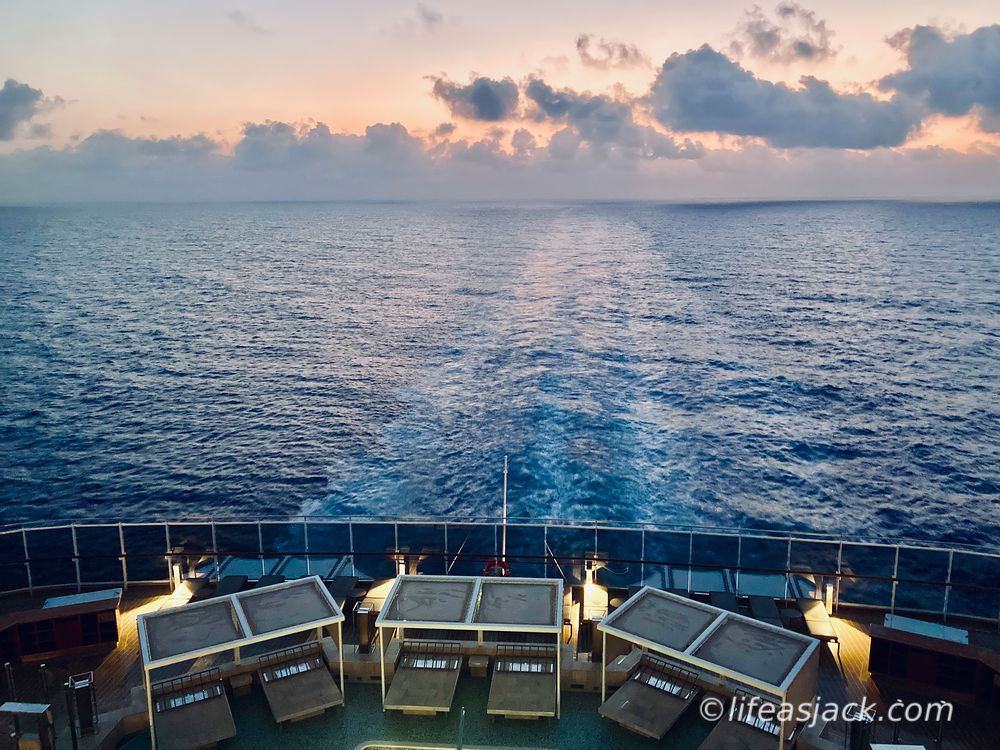wake of a cruise ship at sunset